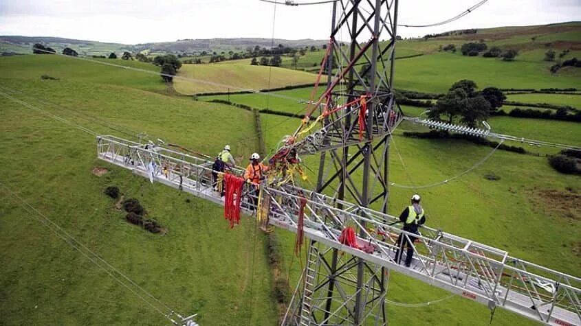 Power transmission line. Overhead transmission line. 500 KV DC transmission line. Overhead Power lines.