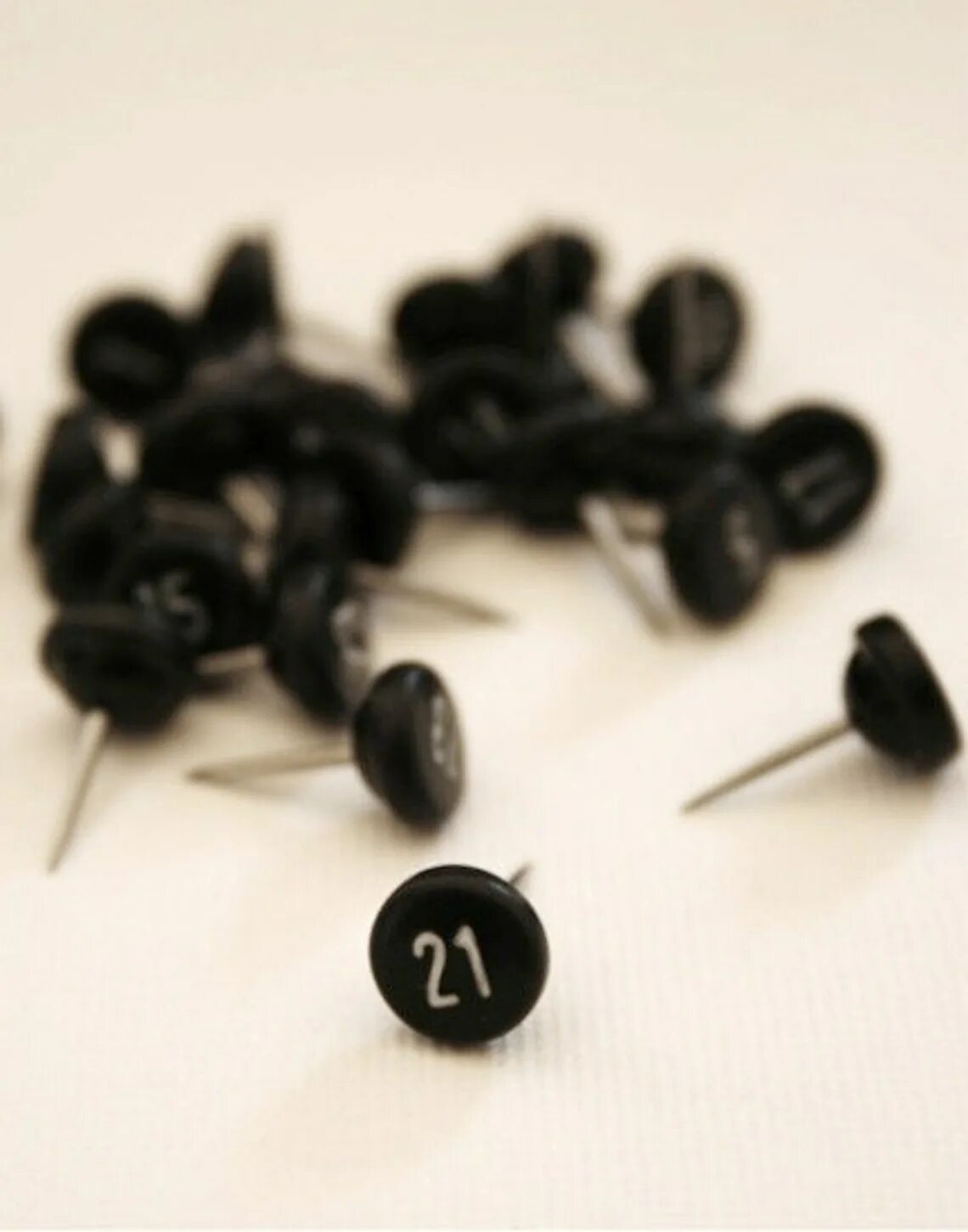 Pins number. Black push pins.