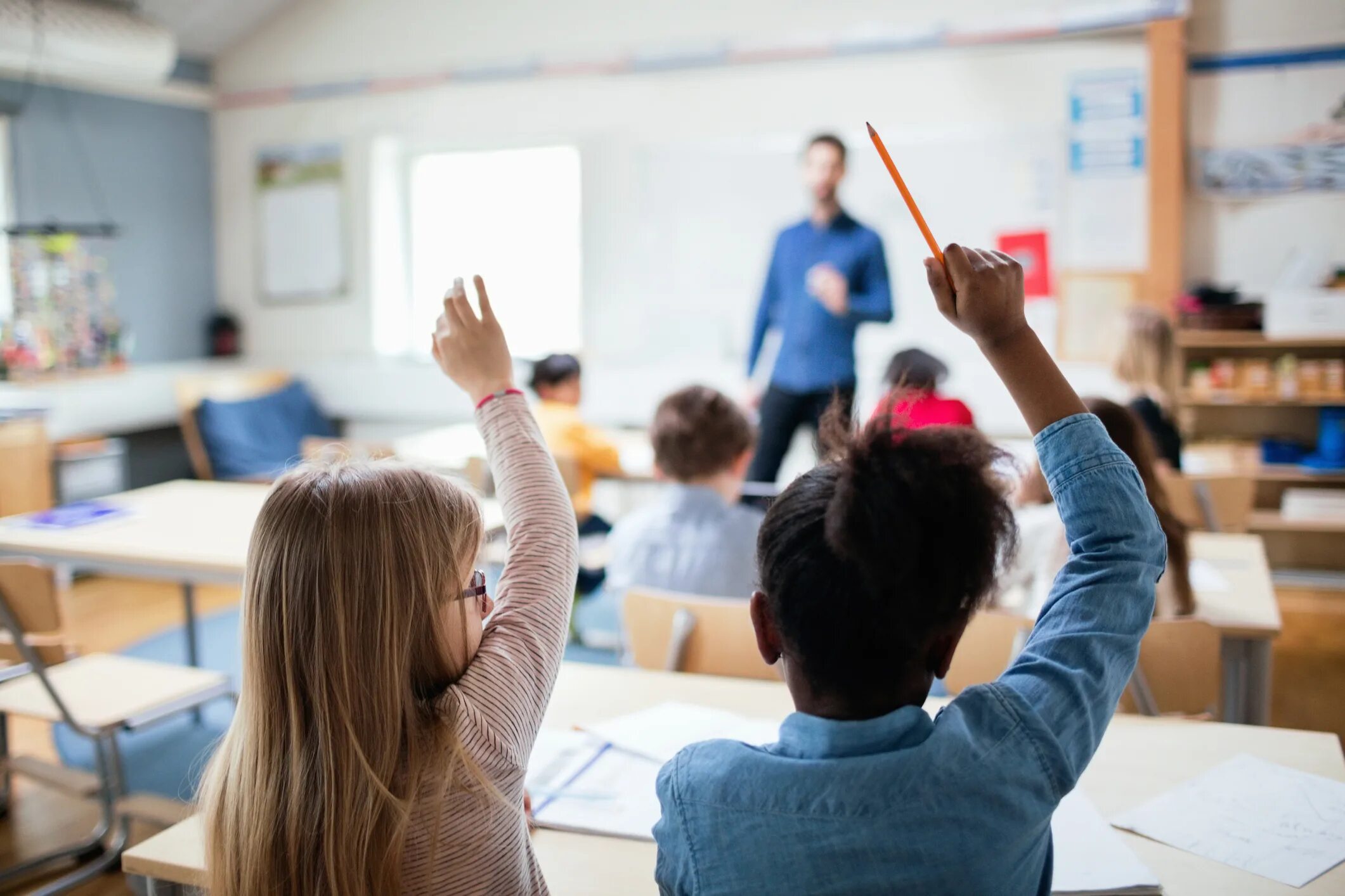 1 lesson school. Ученики размыто. Teacher in the Classroom. Тянет руку школа. Lesson in Classroom.