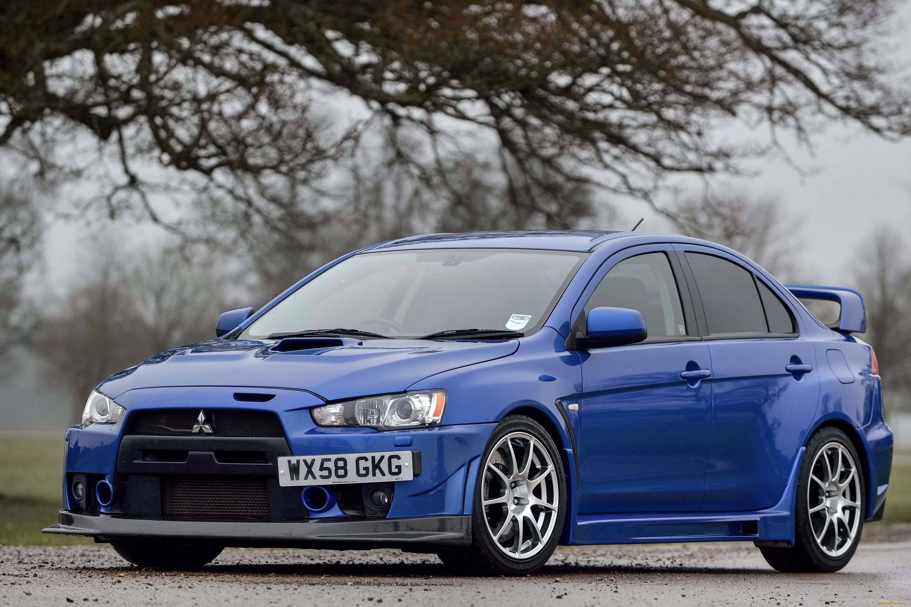 Mitsubishi lancer выпуска. Mitsubishi Lancer Evolution FQ 400. Митсубиси Эволюшн 10. Mitsubishi Lancer EVO 10. Mitsubishi Lancer Evolution x.