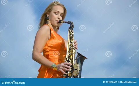 Video about Woman plays saxophone. 