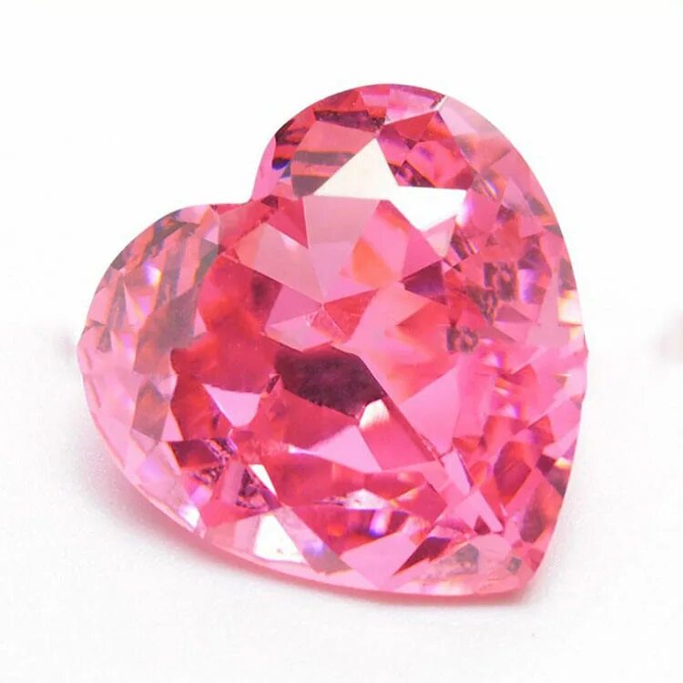 Розовый сапфир 10 карат. Розовый камень. Позовыйдоагоценный камень. Розовый камень в ювелирных.