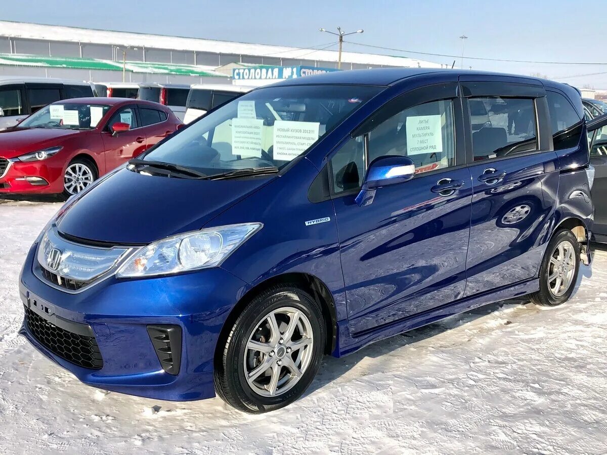 Honda freed g. Хонда Фрид 2012. Honda freed 2012 гибрид. Хонда Фрид гибрид 2012 год. Хонда Фрид 2012 голубой.