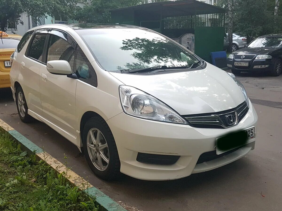 Фит 2012 год. Honda Fit Hybrid 2012. Honda Fit Shuttle Hybrid. Honda Fit Shuttle Hybrid 2012. Хонда фит гибрид 2012 года.