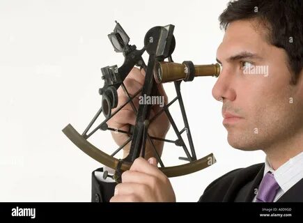 Man holding a sextant Stock Photo. 