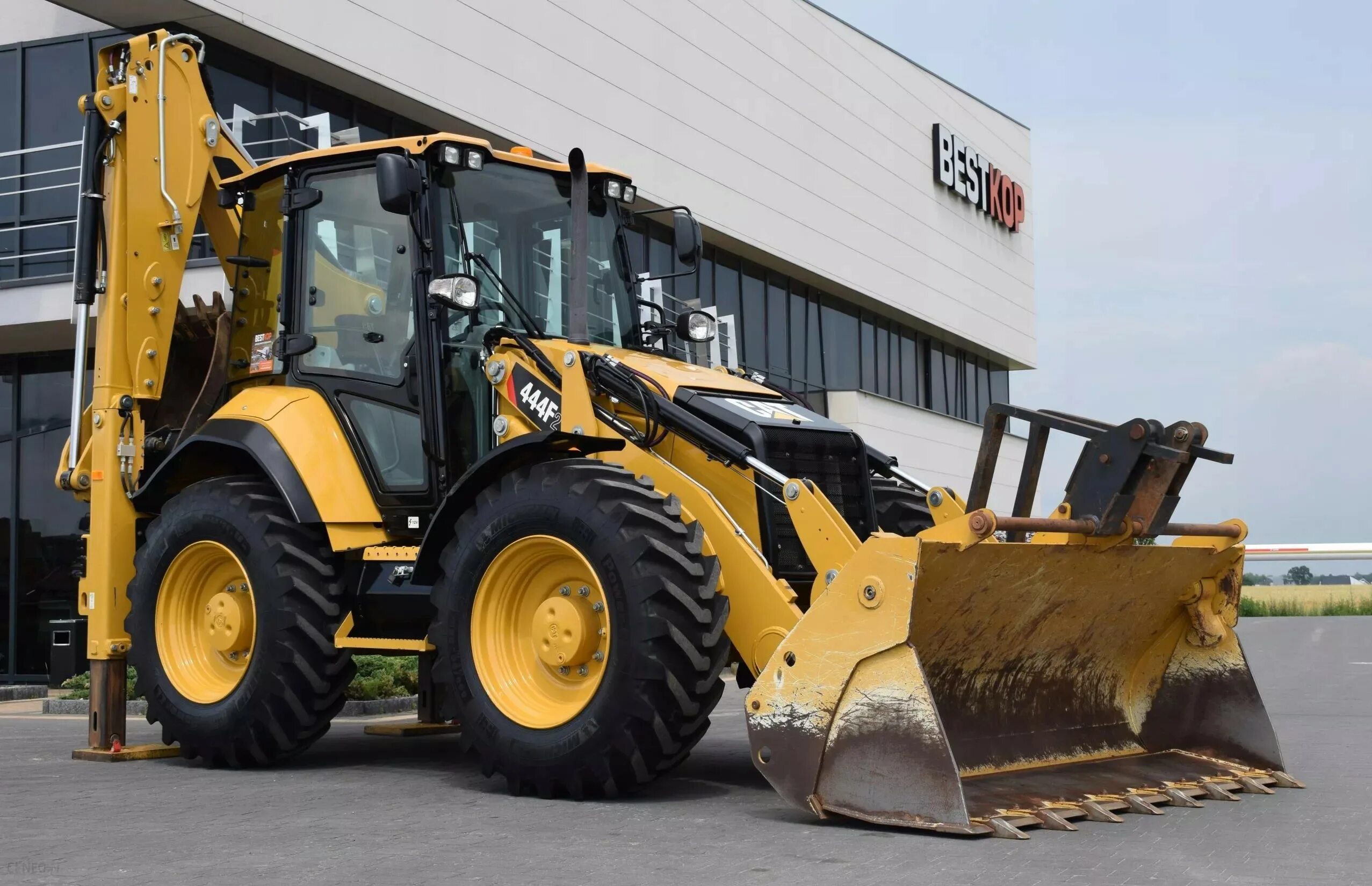 Купить экскаватор катерпиллер. Caterpillar 444f2. Экскаватор-погрузчик Caterpillar 444. Экскаватор-погрузчик Катерпиллер 444 f2. Погрузчик – экскаватор Caterpillar 444f.