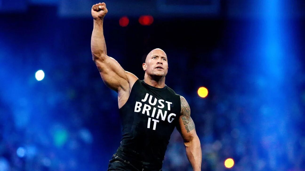 Дуэйн джонсон список чемпионов wwe. Скала WWE. Дуэйн Джонсон 2023. The Rock 1996 WWE. Хака скала Джонсон танец.