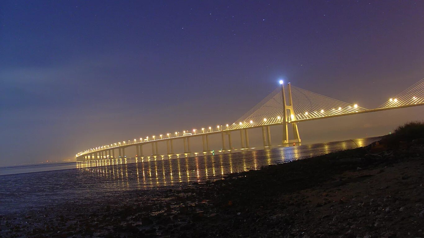 Мост васко да гама в лиссабоне. Португалия мост васко де гамма. Лиссабон река тежу мост васко да гама. Лиссабонский мост васко да гама. Лиссабонский мост васко да гама.