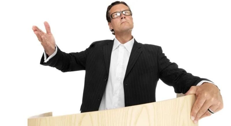 Оратор за трибуной. Спикер с микрофоном. Тренинг по ораторскому искусству. Ораторское искусство. Оратор.