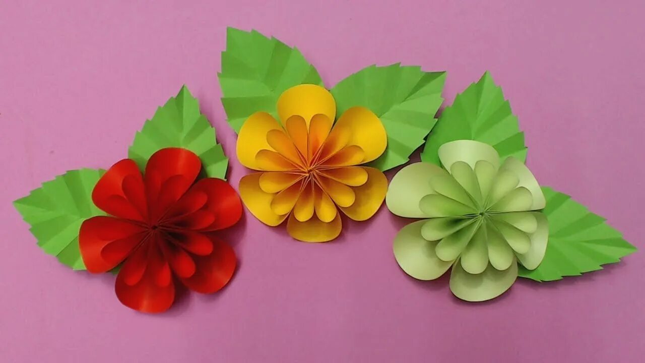 Объемные цветы руками детей. Объемные цветы из бумаги. Поделка цветок из цветной бумаги. Поделка объемные цветы. Объемная аппликация цветы.