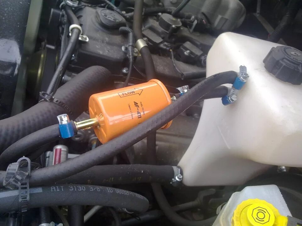 Фильтр в систему охлаждения автомобиля. Фильтр на систему охлаждения ваз 2110. Фильтр системы охлаждения двигателя ваз. Фильтр на систему охлаждения двигателя уаз патриот. Фильтр очистки антифриза камаз.