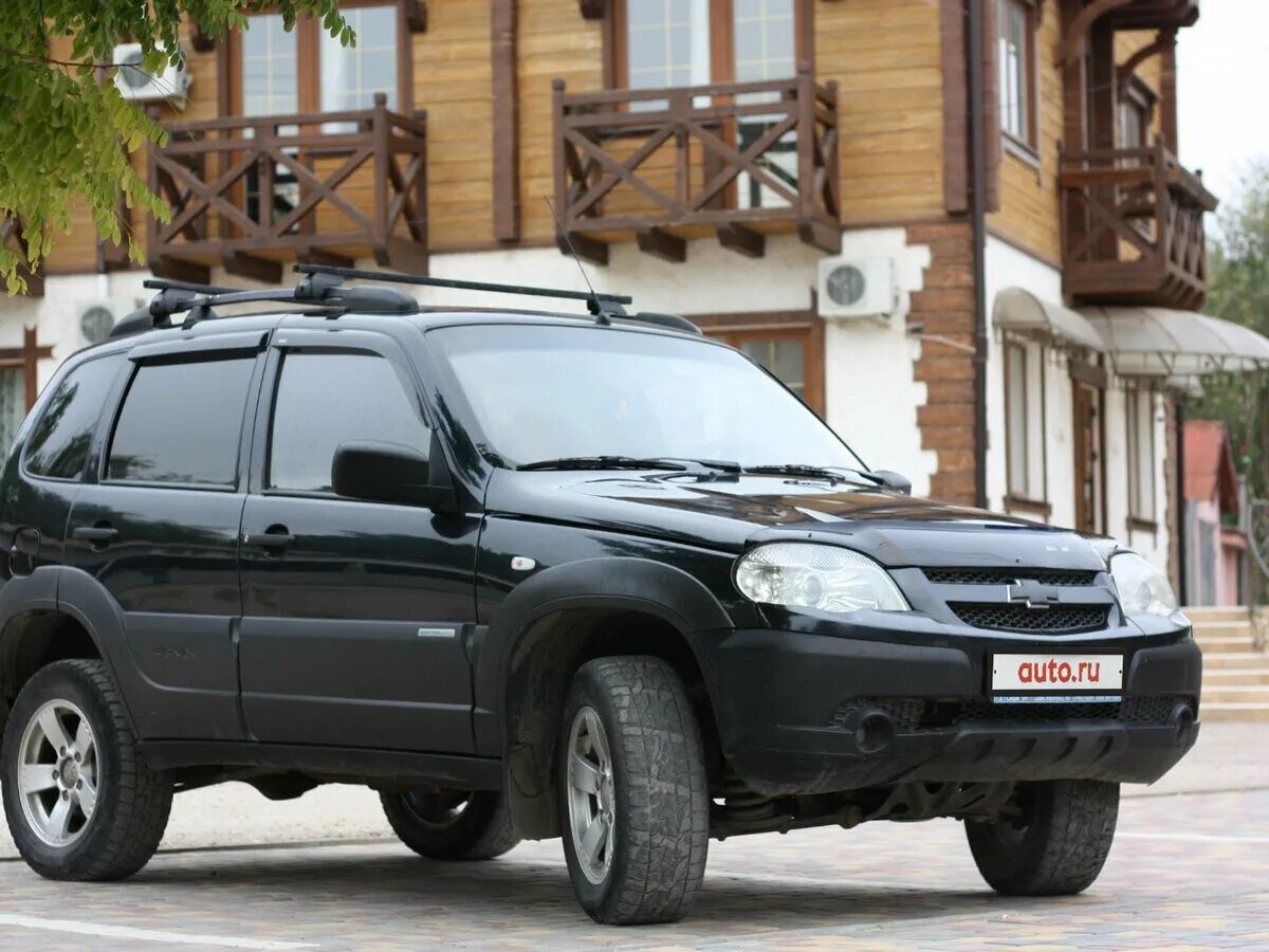 Шеви нива самара купить. Chevrolet Niva 2012. Chevrolet Niva 1.7 МТ 2012 чёрная. Шевроле Нива 1 Рестайлинг. Chevrolet Niva i Рестайлинг чёрный.