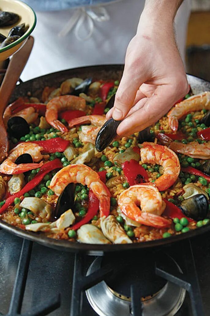Паэлья кухня. Паэлья испания. паэлья с морепродуктами испания. испанская еда paella. паэлья с хамоном.