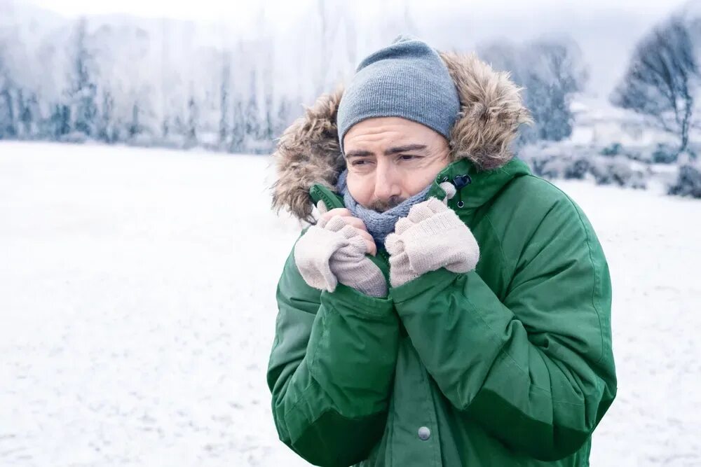 Warming with cold weather. Freezing cold. freezing cold weather. cold man. a man in a cold weather.
