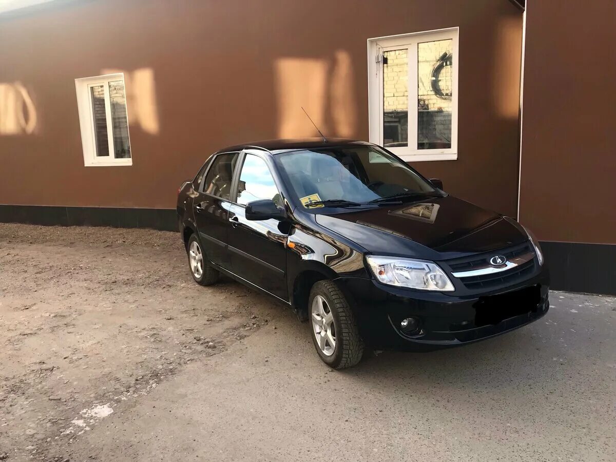 Lada Гранта 1.6 бензиновый 2013 Черный люкс на DRIVE2
