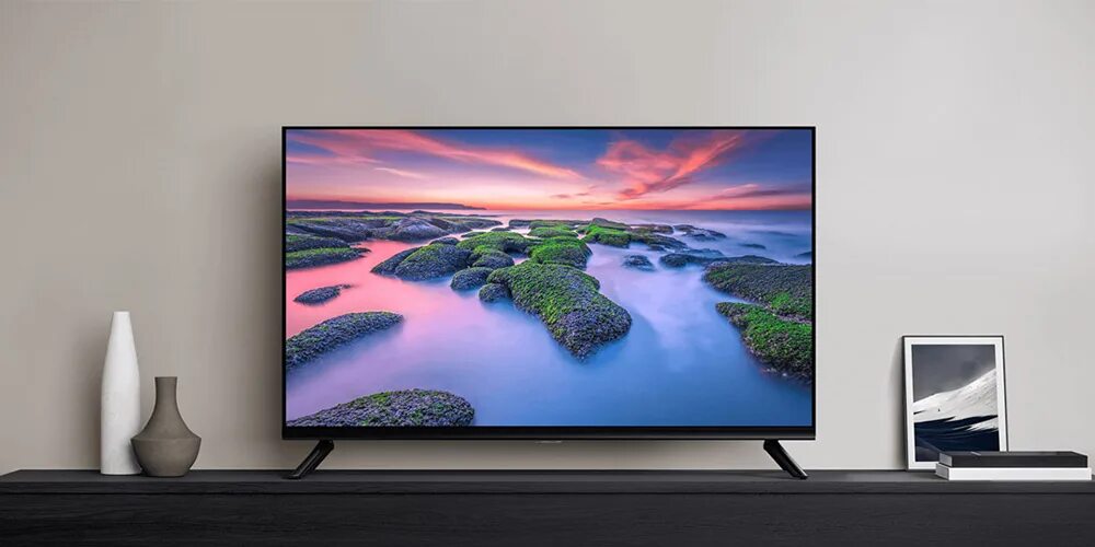 Какой формат поддерживает телевизор xiaomi. Xiaomi a2 телевизор. xiaomi tv a2. телевизор xiaomi smart tv 32. xiaomi mi tv a2 пульт.