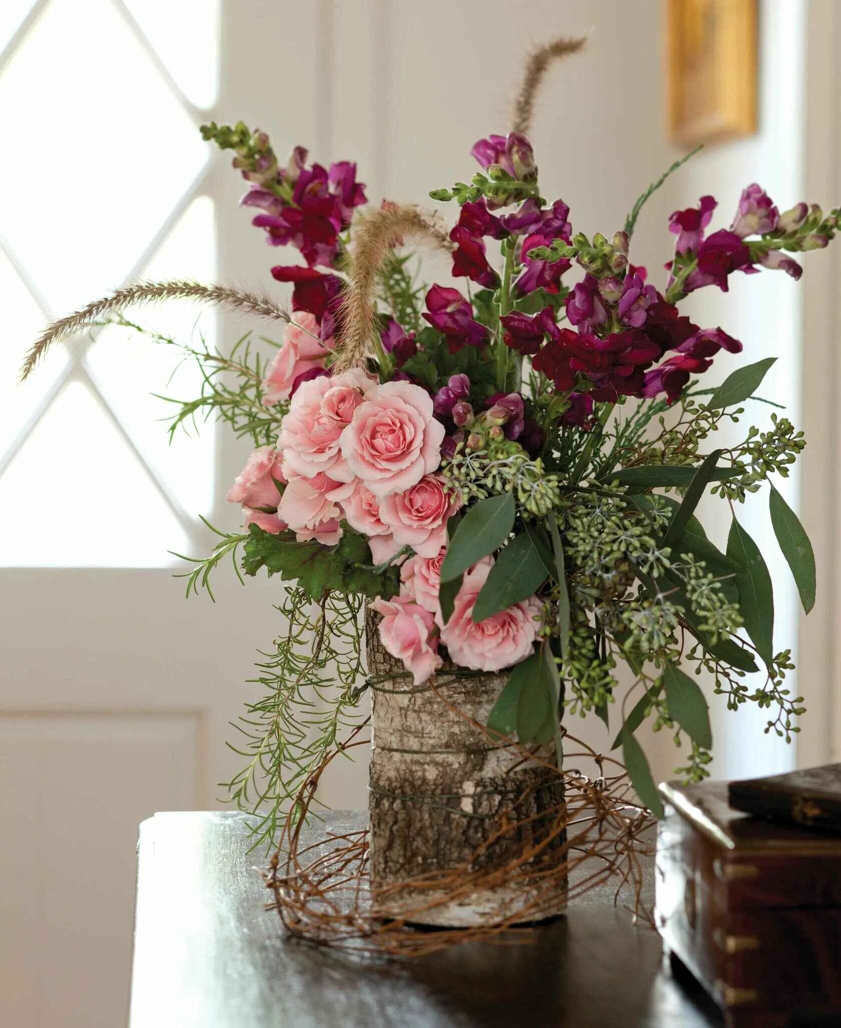 Artificial Flower Arrangement with Roses and Sunflowers in a Clear Glass. Contem