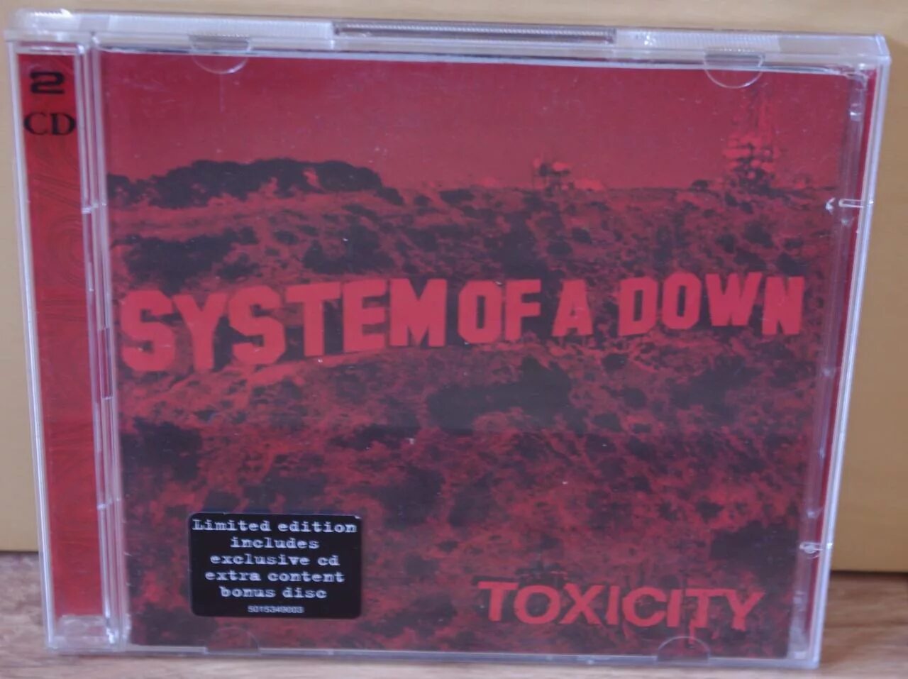 System of a down toxicity текст. System of a down 2001 Toxicity. System of a down Toxicity 2001 Cover. Toxicity альбом. Toxicity обложка альбома.