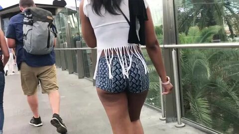 Chunky ebony butts hanging out of short skirts