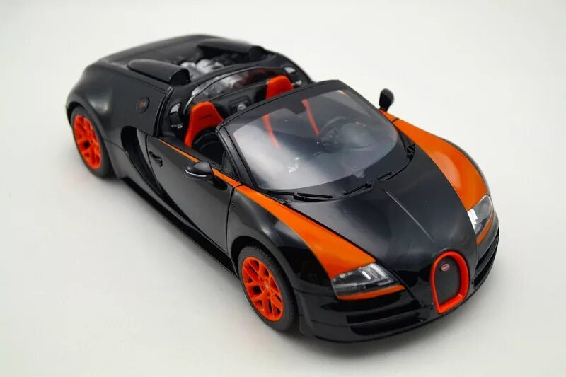 Bugatti models. Bugatti Veyron 16.4 Grand Sport Vitesse Rastar. Bugatti Veyron 1 18. 1:18 Bugatti Veyron 16.4 Grand Sport Vitesse черный / оранжевый 1:18. Bugatti Veyron 16.4 модель Grand Sport Vitesse 2012.