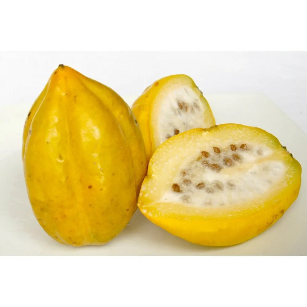 Фрукт желтый похож. Желтый фрукт. экзотические фрукты желтого цвета. желтый фрукт с косточкой. тропический фрукт желтого цвета.