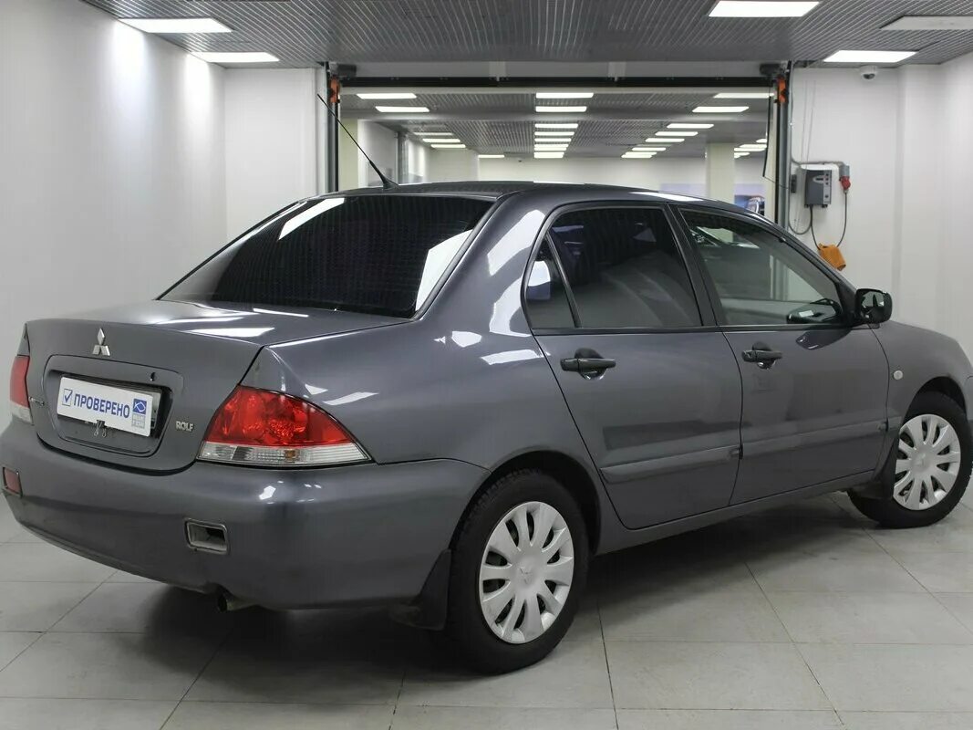 Купить лансер 9 с пробегом. Мицубиси Лансер 2006. Mitsubishi Lancer Rolf 2006. Митсубиси Лансер 2006 1.3. Мицубиси ланцер 2006.