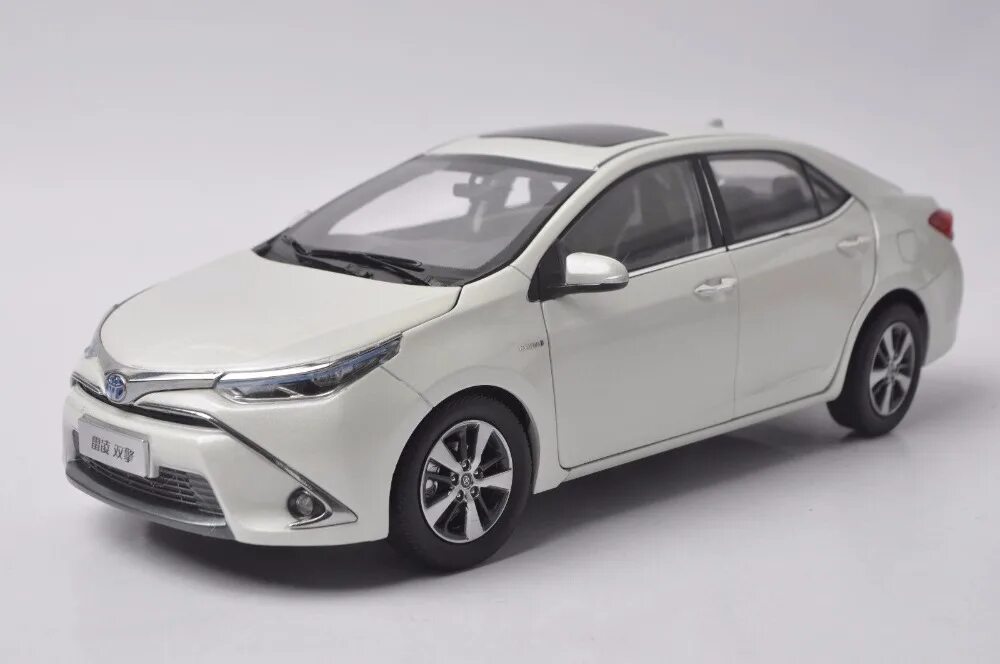 1 18 Toyota Corolla. Тойота Королла Велли. Toyota Corolla 2014 Hybrid. Welly Toyota Corolla.