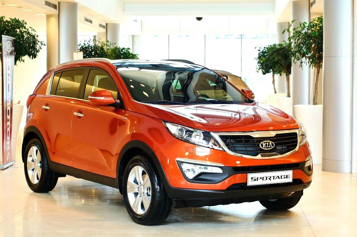 Что лучше купить киа. Kia Sportage 2011. Kia Sportage 2010 красный. Киа Оптима Спортейдж. Kia Sportage 2012.