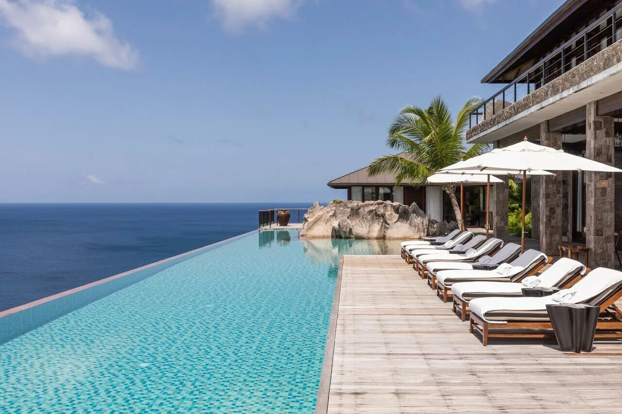 Four seasons seychelles. Сейшелы отель four seasons. four seasons mahe пляж. сейшелы отели 5 звезд. four seasons пляжные отели.