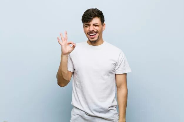 He s wearing a t shirt. White guy with arm tattoos white t shirt phone case smart watch. white guy with arm tattoos white t shirt phone case smart watch selfie.