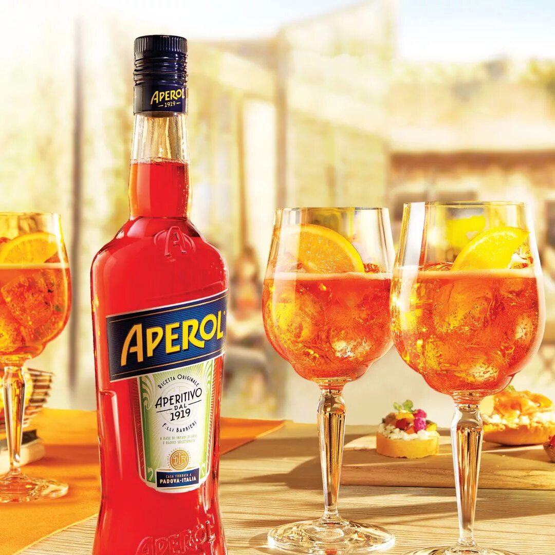 С чем пьют апероль в домашних. Аперитив Апероль. Аперитив Aperol. Апероль ликер. Напиток аперитив Апероль аперитив.