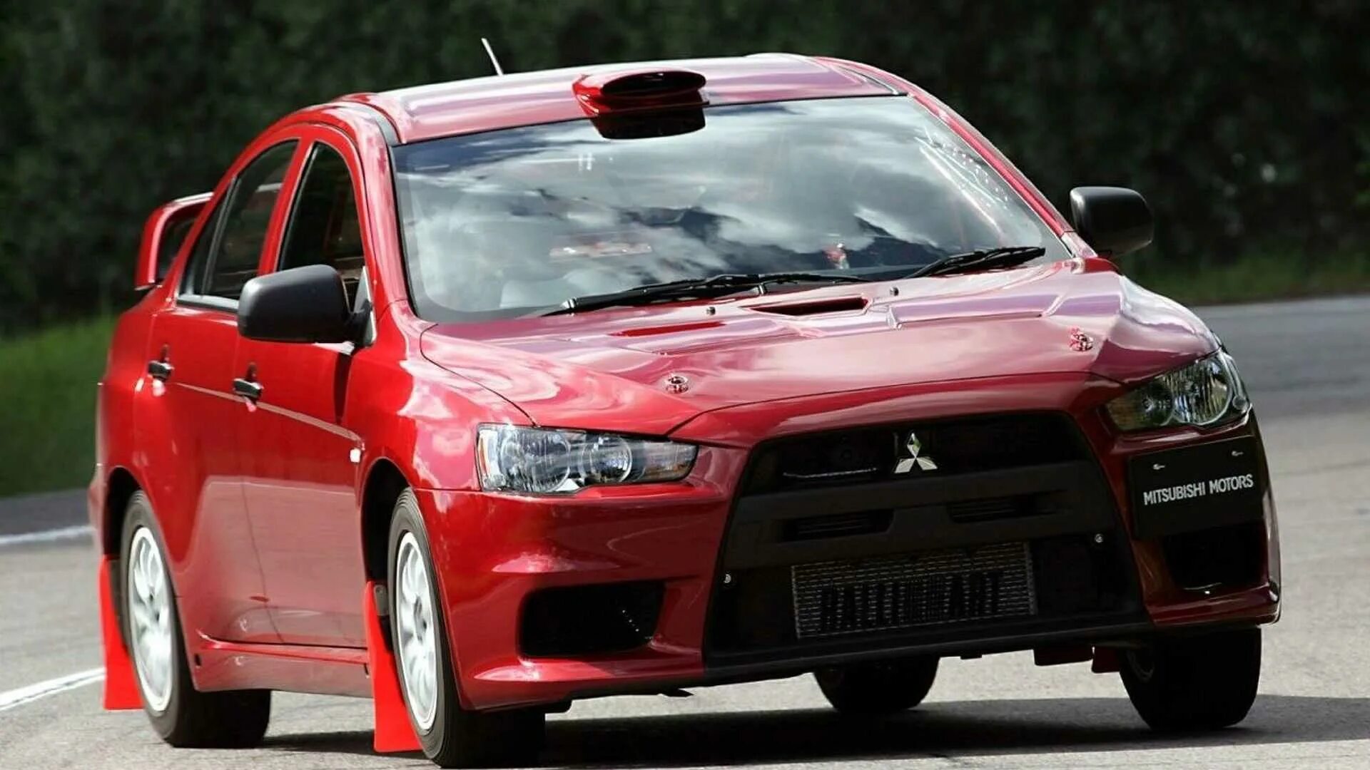 Мицубиси производитель. Mitsubishi Lancer EVO 2007. Mitsubishi Lancer Evolution x (2007). Митсубиси Лансер Эволюшн 10. Mitsubishi EVO 2007 Lancer 10.