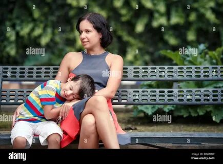 Portrait of mother and son sitting outdoors Stock Photohttps. 