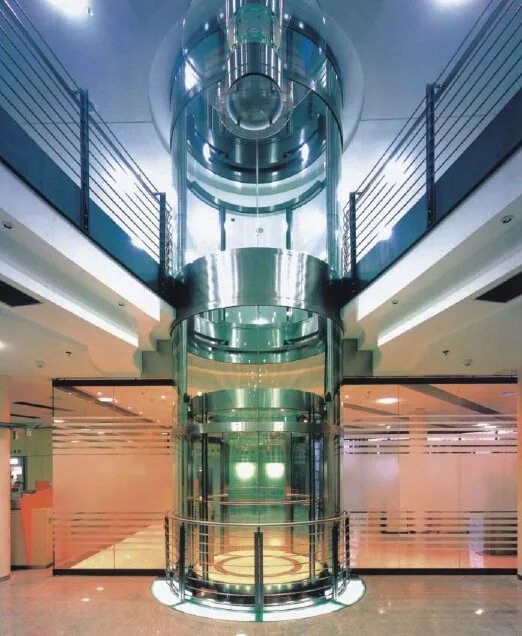 винтовая лестница в общественных зданиях. лифт в общественном здании. стеклянный лифт в коттедж. спиральная лестница микеланджело. панорамный лифт отис.