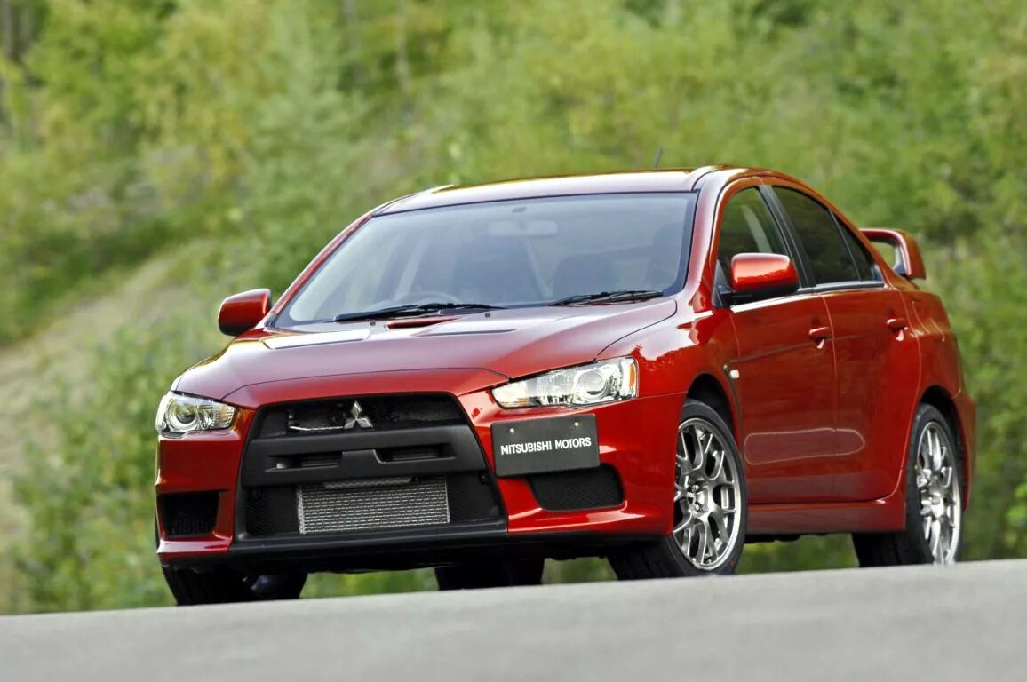 Mitsubishi evo 11 2024. Мицубиси Эволюшн 10. Митсубиси Лансер Эволюшн. Лансер 10 Эволюшн. Митсубиси Лансер 10.