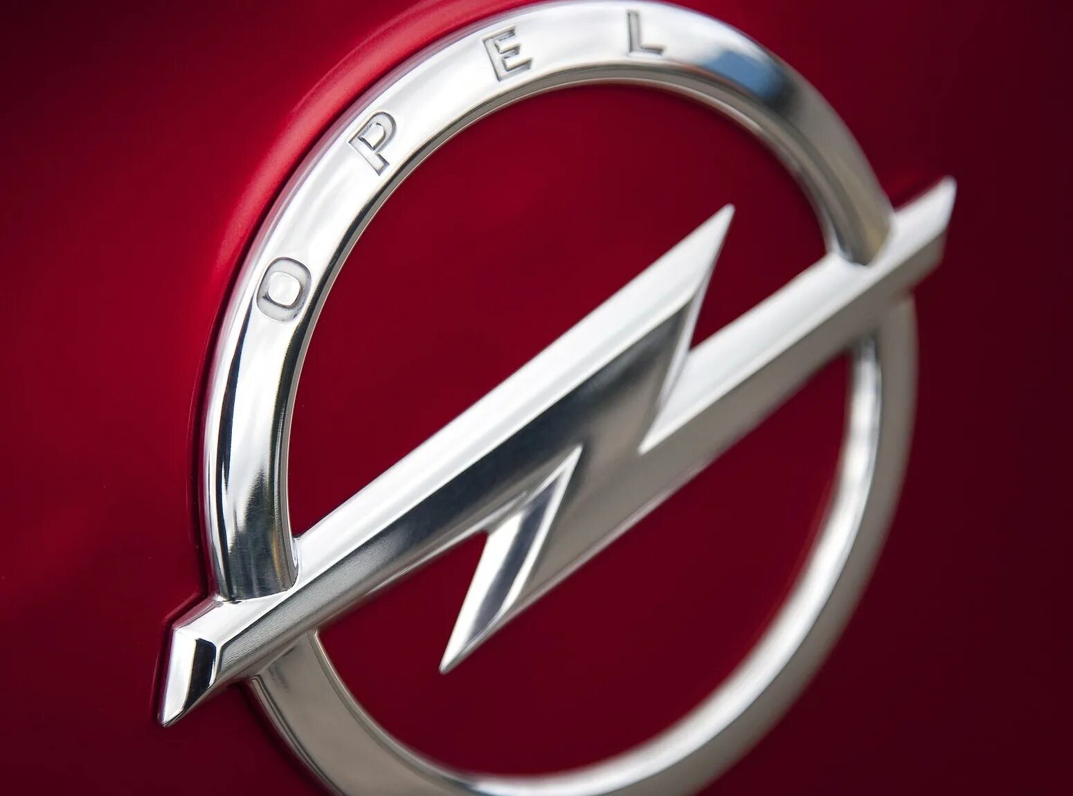 Компания opel. Опель лого. Opel Emblem. Опель значок. Опель знак на машине.