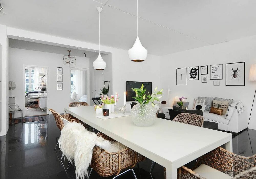white walls, living room dining room combo, white sofa, brown leather chairs,. M