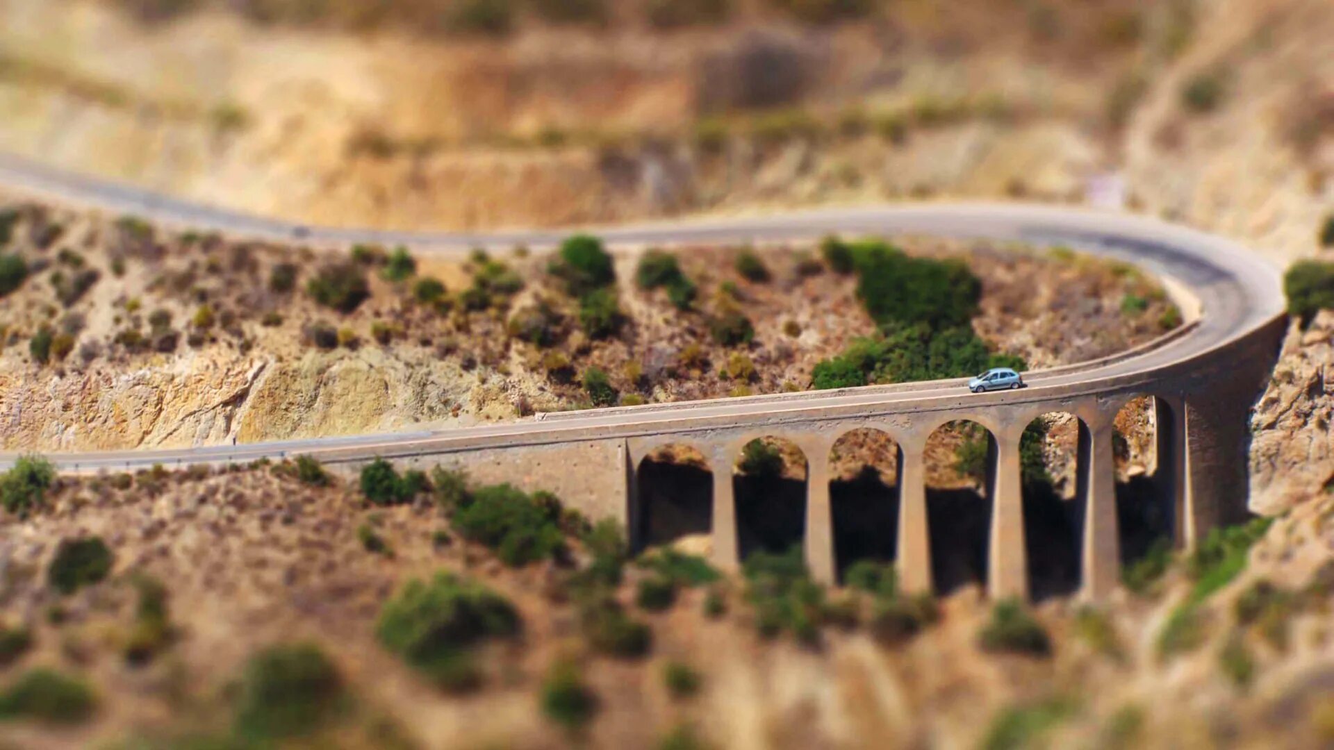 Man made world. Tilt Shift. Обои тилт шифт. Tilt Shift пейзаж. Зимняя Горная дорога тилт-шифт.