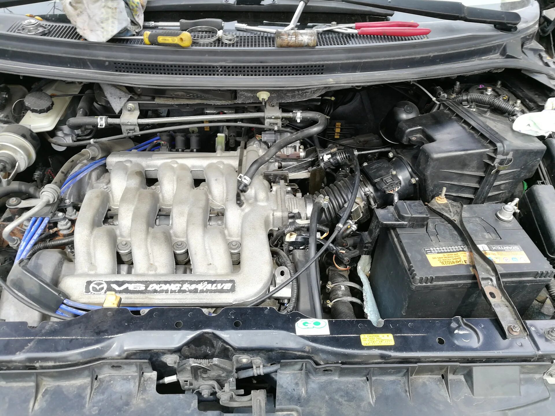 Двигатель мпв 2.5. Mazda mpv 3.0 под капотом. двс мазда мпв 2.5.