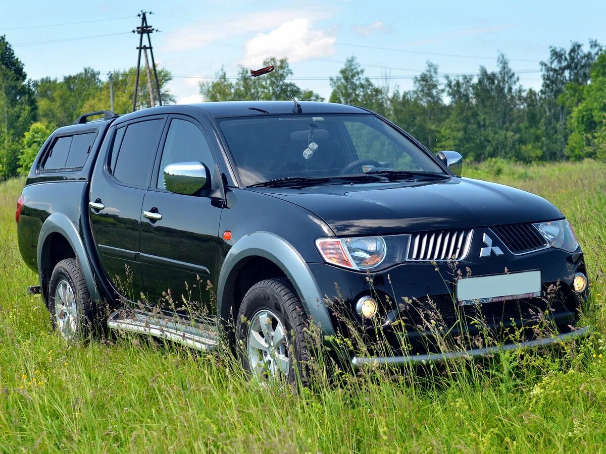 Мицубиси л200 с пробегом. Митсубиси l200. Митсубиси л200. Mitsubishi l200 IV. Митсубиси л200 200.