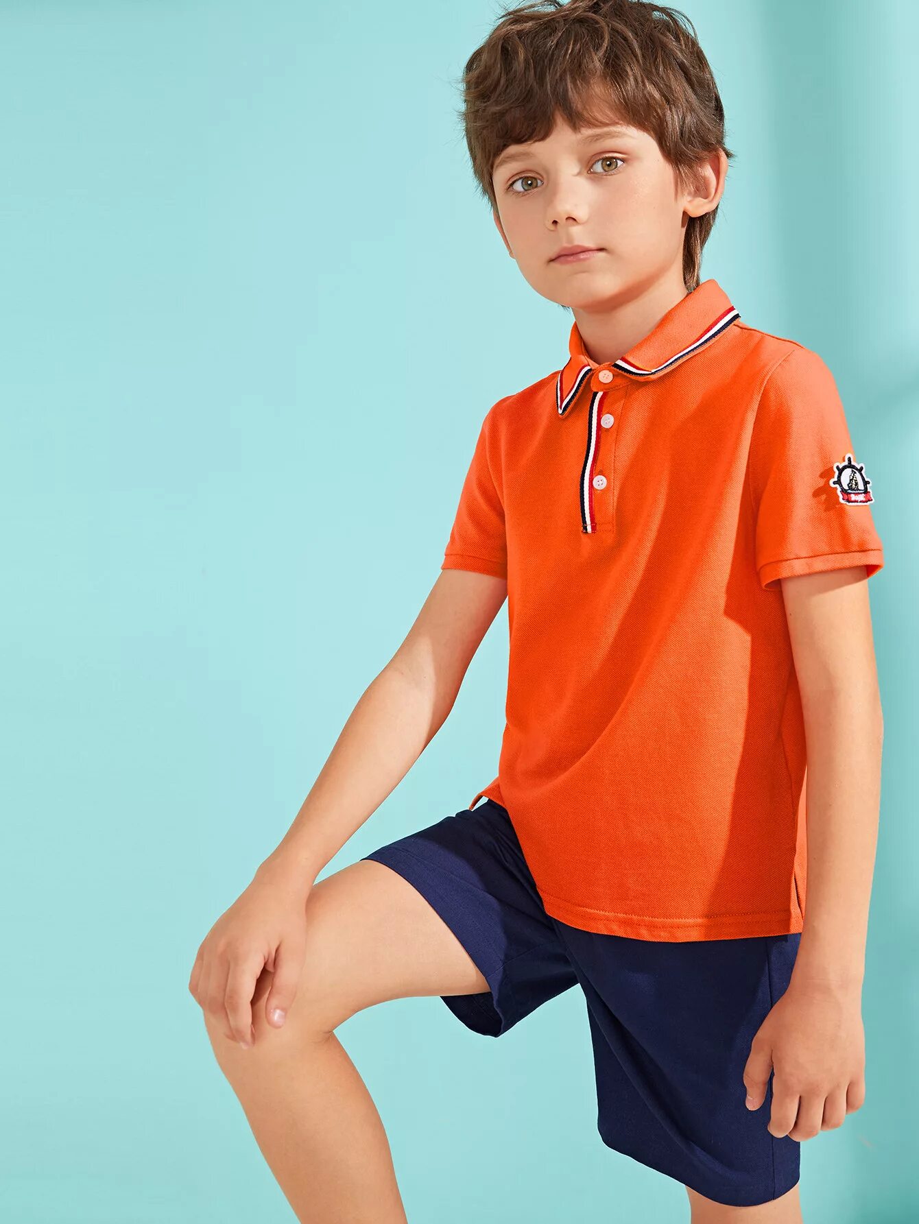 Шорты для мальчика оранжевые. Юноша в оранжевом. Оранжевая одежда для мальчиков. Мальчик 7 лет в оранжевых. Boys polo