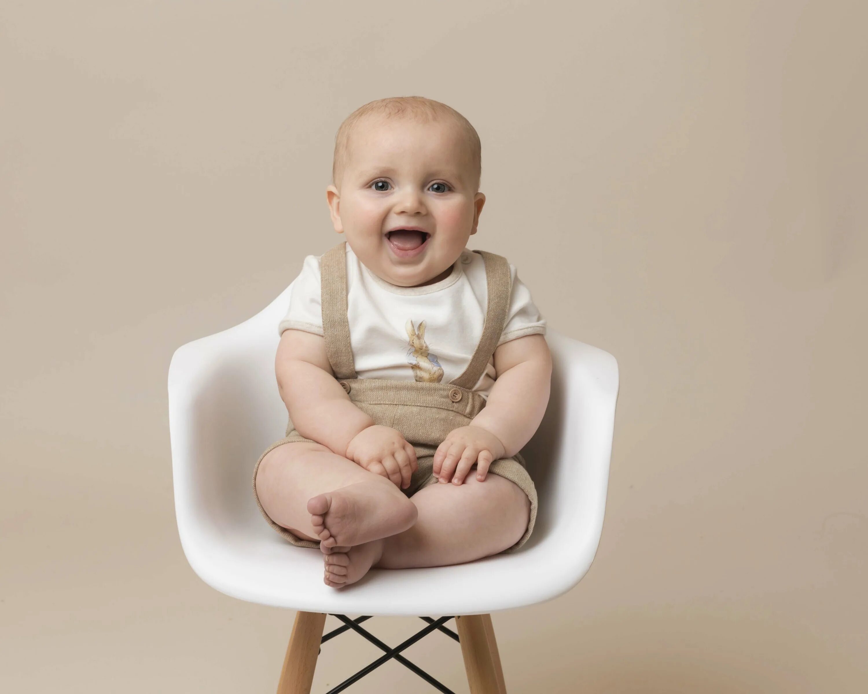 Baby sitting Chair. Baby sitting in Chair. Baby on the Chair.