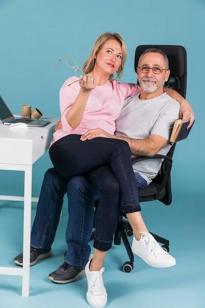 Woman sitting on lap. Woman on man's lap. Sitting on a man's lap.