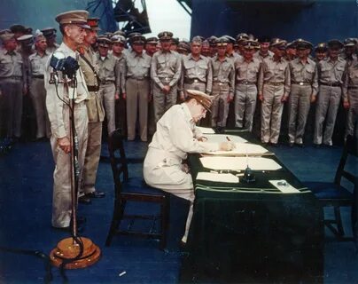 MacArthur signing Japanese surrender aboard USS Missouri, 2 Sep 1945, photo 2 of 4 Do...