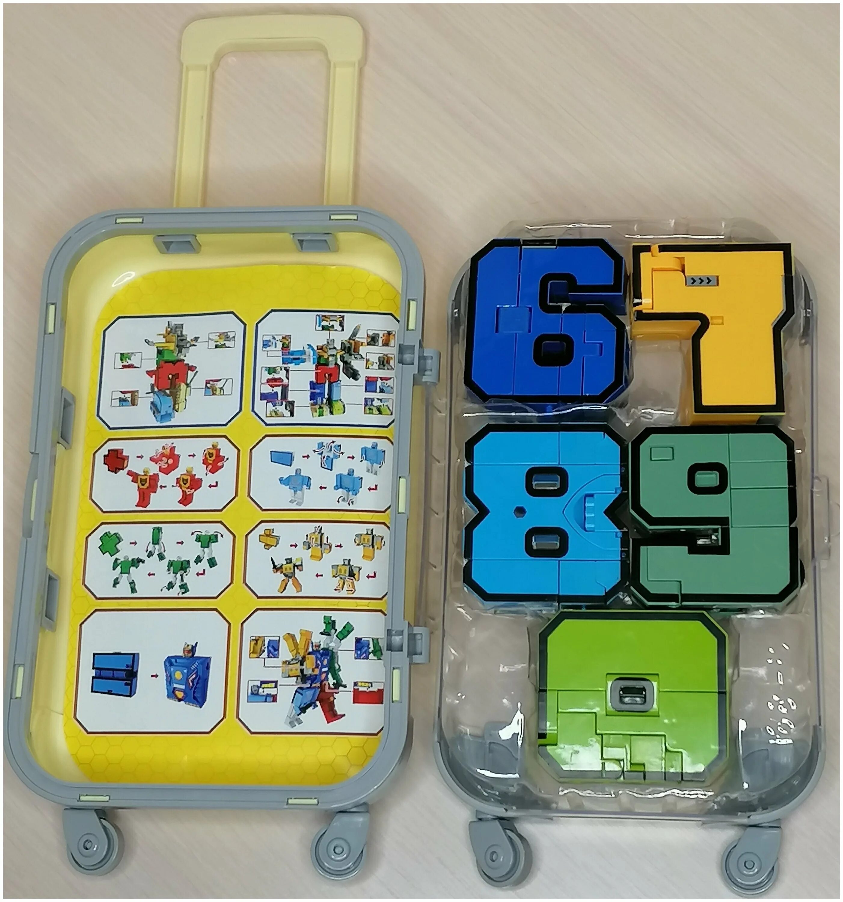 набор цифр трансформеров в чемодане. цифры трансформеры yb188-41e. цифры трансформеры в чемодане. конструктор цифры в чемодане. чемодан с цифрами.