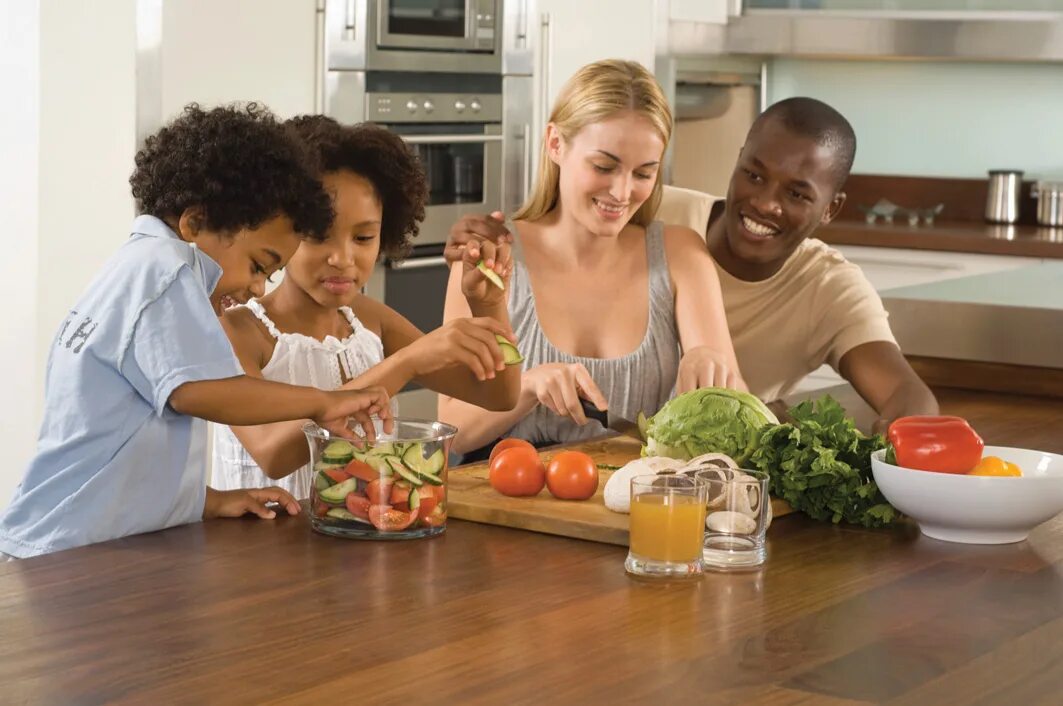 Family Cooking. Family eat in Kitchen. A Family Cooking in the Kitchen. Kitchen Cooking Family.