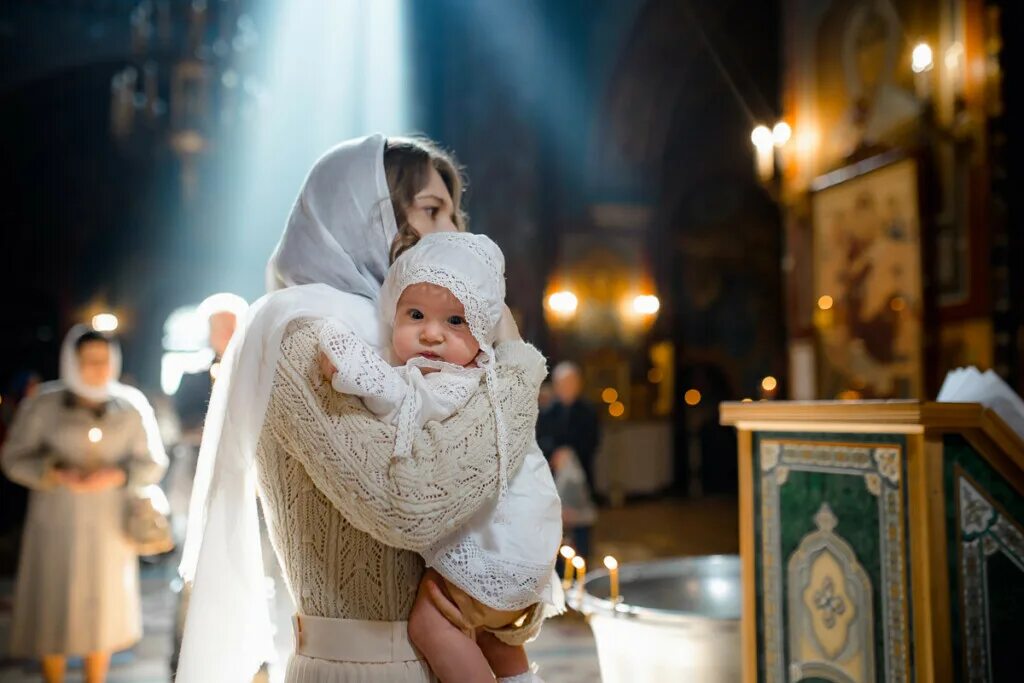 батюшка освещает прорубь. крещение 2021. крещение господне (святое богоявление). крещение в храме спаса преображения. объявление на крещение господне.