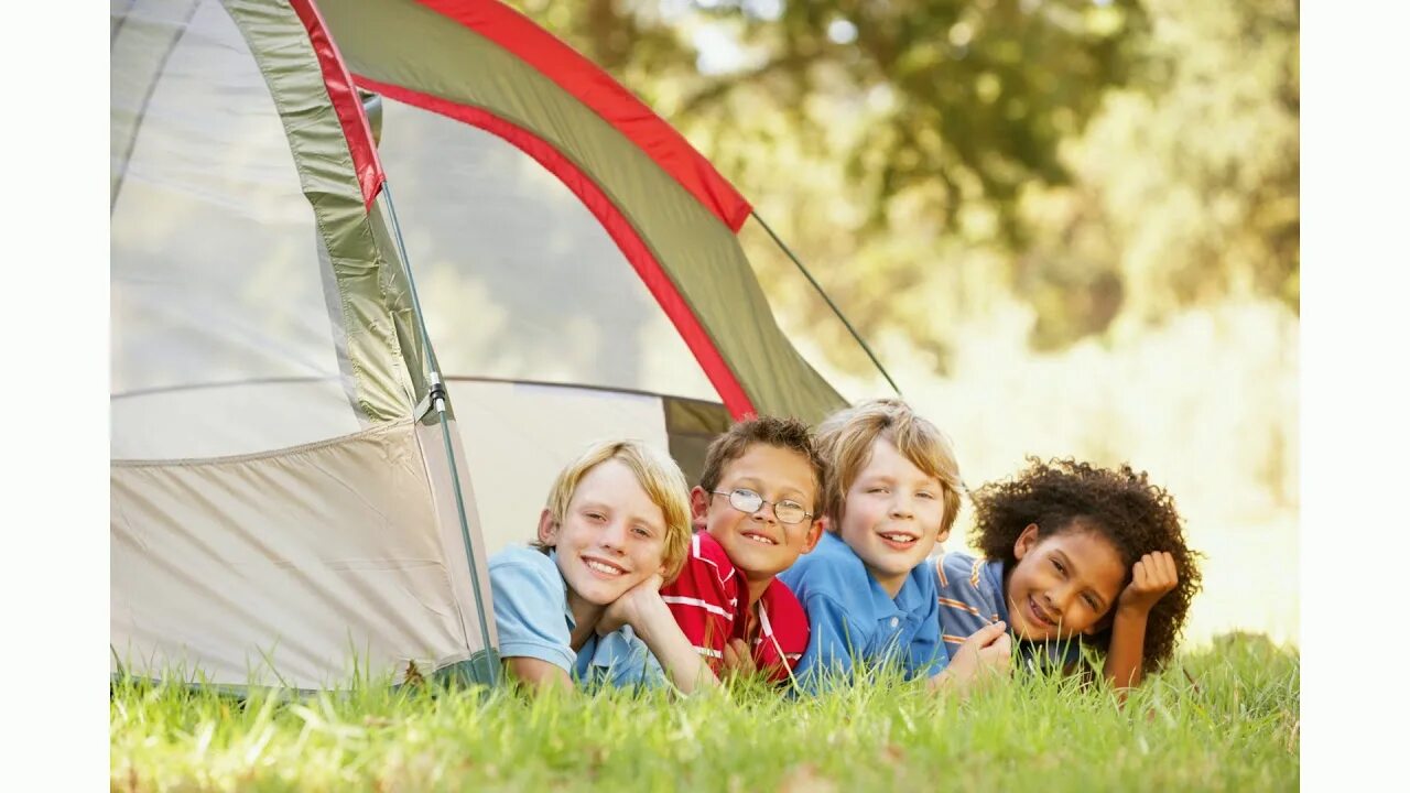 Go on a camp. Лето дети сильный. camping tent by the lake. summer camp. a boy in the tent.