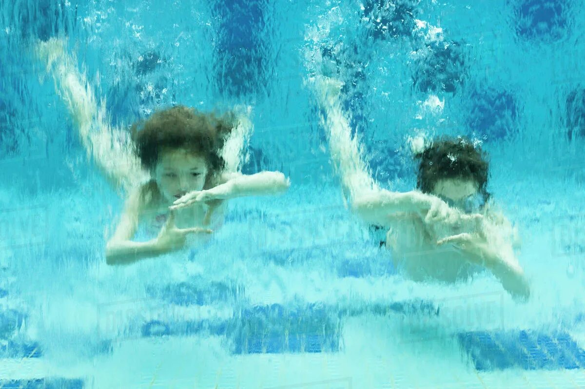 Sisters and brother swimming.