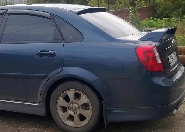 Спойлер шевроле лачетти. Chevrolet Lacetti 2004 спойлер. Chevrolet Lacetti седан спойлер. Лип спойлер Шевроле Лачетти седан. Lacetti со спойлером Chevrolet Lacetti.